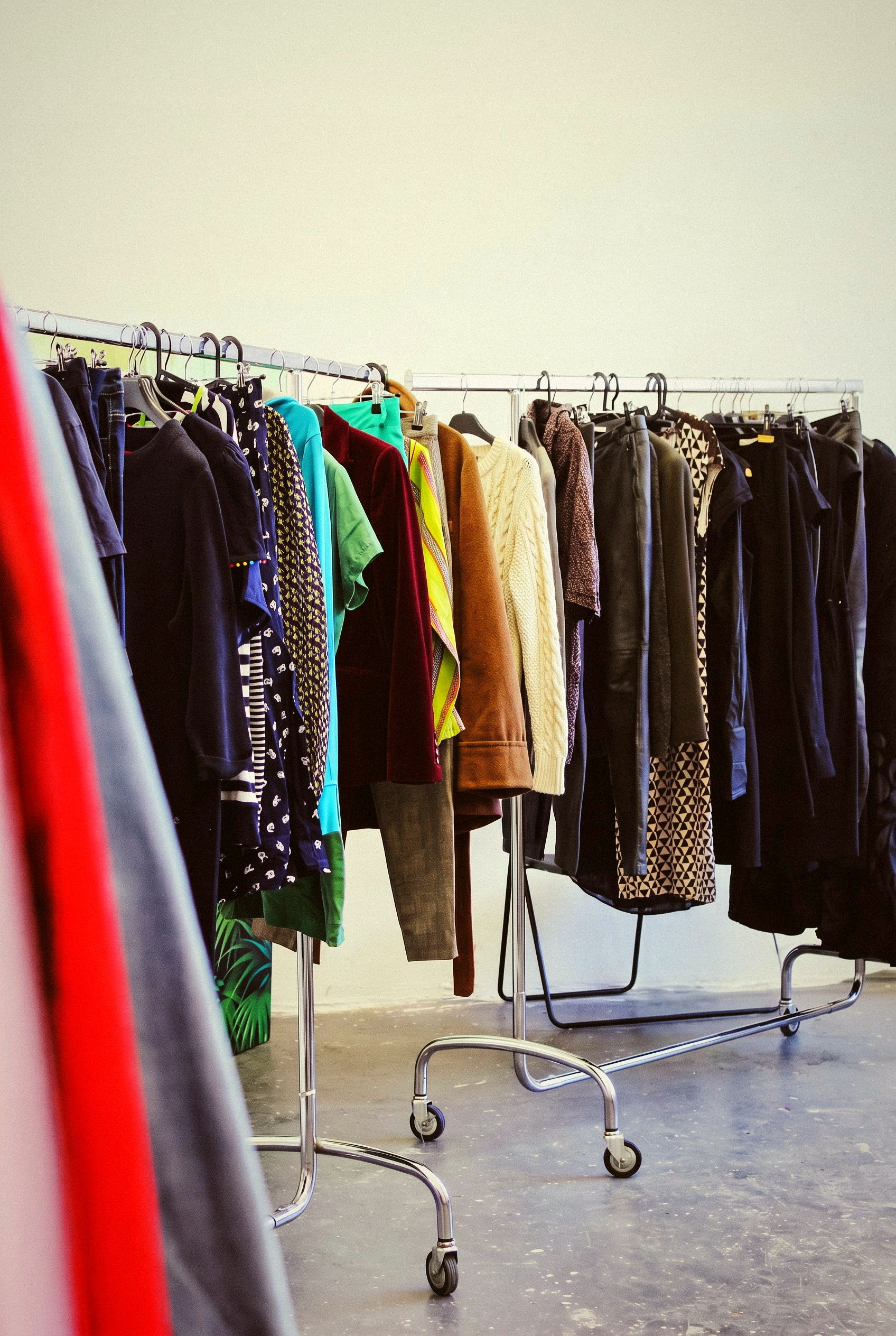 Pressed curated garments on rails